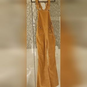Free People gold brown corduroy jumpsuit with side zipper. Size 31, runs small.
